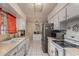 Kitchen with white cabinets, stainless steel appliances, and tile floor at 3017 W Hearn Rd, Phoenix, AZ 85053