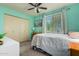 Bright bedroom with double bed, closet, and window at 3017 W Hearn Rd, Phoenix, AZ 85053