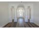 Elegant entry hall with hardwood floors and arched doorways at 1223 E Clearview Dr, Casa Grande, AZ 85122