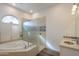 Bathroom with soaking tub, walk-in shower and decorative tile at 1223 E Clearview Dr, Casa Grande, AZ 85122