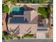 House with solar panels, pool, and landscaped yard; aerial view at 1223 E Clearview Dr, Casa Grande, AZ 85122