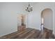 Spacious dining room with wood floors and views into other rooms at 1223 E Clearview Dr, Casa Grande, AZ 85122