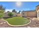 Landscaped backyard with artificial turf and sitting area at 1223 E Clearview Dr, Casa Grande, AZ 85122