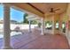 Covered patio with pool access and terracotta tile flooring at 1223 E Clearview Dr, Casa Grande, AZ 85122