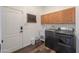 Laundry room with washer, dryer, and cabinets at 1223 E Clearview Dr, Casa Grande, AZ 85122