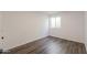 Simple bedroom with hardwood floors and a window at 1223 E Clearview Dr, Casa Grande, AZ 85122