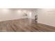 Bright basement recreation room with wet bar and hardwood floors at 1223 E Clearview Dr, Casa Grande, AZ 85122