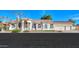 Beautiful tan house with tile roof, columns and 3 car garage at 1223 E Clearview Dr, Casa Grande, AZ 85122