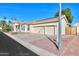 Beautiful home with three-car garage, mature landscaping, and a large driveway at 1223 E Clearview Dr, Casa Grande, AZ 85122