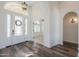 Bright entry with hardwood floors, arched doorways and a lovely glass front door at 1223 E Clearview Dr, Casa Grande, AZ 85122