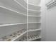 Large pantry with white shelving and floral-patterned shelf liners at 1223 E Clearview Dr, Casa Grande, AZ 85122