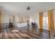 Open concept living area showcasing hardwood floors and a view of the kitchen at 1223 E Clearview Dr, Casa Grande, AZ 85122