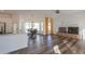 Open concept living room with hardwood floors and fireplace, adjacent to kitchen at 1223 E Clearview Dr, Casa Grande, AZ 85122