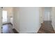 Clean hallway with wood floors and access to bathroom and other rooms at 1223 E Clearview Dr, Casa Grande, AZ 85122