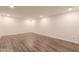 Open basement showcasing wood flooring and a wet bar area at 1223 E Clearview Dr, Casa Grande, AZ 85122