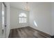 Spacious bedroom with wood flooring and arched window at 1223 E Clearview Dr, Casa Grande, AZ 85122
