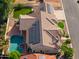 Aerial view showcasing a home with solar panels and a pool at 1223 E Clearview Dr, Casa Grande, AZ 85122
