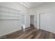 Bright bedroom with built-in shelving and wood floors at 1223 E Clearview Dr, Casa Grande, AZ 85122