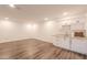Finished basement with wet bar and wood-look flooring at 1223 E Clearview Dr, Casa Grande, AZ 85122