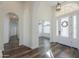 Light and airy entryway with hardwood floors and arched hallway at 1223 E Clearview Dr, Casa Grande, AZ 85122