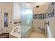 Spa-like bathroom with walk-in shower, soaking tub, and artistic tile at 1223 E Clearview Dr, Casa Grande, AZ 85122