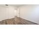 Bedroom with double doors to closet and wood-look floors at 1223 E Clearview Dr, Casa Grande, AZ 85122
