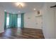 Bright bedroom with hardwood floors and teal curtains at 1223 E Clearview Dr, Casa Grande, AZ 85122