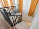 Elegant staircase with dark wood railing and light stone steps at 1223 E Clearview Dr, Casa Grande, AZ 85122