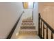 Stunning staircase features colorful tile and a dark wood railing at 1223 E Clearview Dr, Casa Grande, AZ 85122