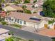 Single-story home with solar panels and a three-car garage at 1223 E Clearview Dr, Casa Grande, AZ 85122