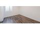 Bright bedroom with wood-look floors and a window at 1223 E Clearview Dr, Casa Grande, AZ 85122