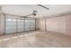Garage with opener, built-in cabinets, and epoxy flooring at 14766 W Piccadilly Rd, Goodyear, AZ 85395