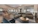 Spacious living room with comfortable seating and tile floors at 14766 W Piccadilly Rd, Goodyear, AZ 85395