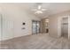 Spacious bedroom with ceiling fan and sliding door to patio at 14766 W Piccadilly Rd, Goodyear, AZ 85395