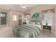 Spacious bedroom with ceiling fan and ensuite bathroom at 14766 W Piccadilly Rd, Goodyear, AZ 85395