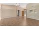Bright and airy living room with tile floors and high ceilings at 14766 W Piccadilly Rd, Goodyear, AZ 85395