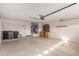 Garage with utility sink, cabinets, and ample space at 14766 W Piccadilly Rd, Goodyear, AZ 85395