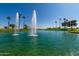 Pond with water fountain, surrounded by palm trees at 14766 W Piccadilly Rd, Goodyear, AZ 85395