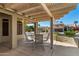 Covered patio with seating area, perfect for outdoor dining and relaxation at 14766 W Piccadilly Rd, Goodyear, AZ 85395