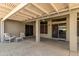 Covered patio with pergola, seating area, and access to backyard at 14766 W Piccadilly Rd, Goodyear, AZ 85395