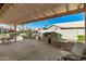 Covered patio with built-in BBQ, pergola, and backyard view at 14766 W Piccadilly Rd, Goodyear, AZ 85395