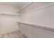 Walk-in closet with ample shelving and hanging space at 14766 W Piccadilly Rd, Goodyear, AZ 85395