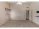 Bright bedroom with ceiling fan and walk-in closet at 14766 W Piccadilly Rd, Goodyear, AZ 85395