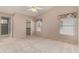 Bright bedroom with ceiling fan and walk-in closet at 14766 W Piccadilly Rd, Goodyear, AZ 85395