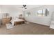 Spacious bedroom with carpeted floors and ample natural light at 7322 E Greenway St, Mesa, AZ 85207