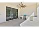 Outdoor kitchen with stainless steel appliances, ceiling fan and sliding glass doors at 2041 N Orchard --, Mesa, AZ 85213