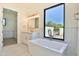 Luxurious bathroom featuring a soaking tub and walk-in shower at 2041 N Orchard --, Mesa, AZ 85213