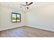 Bright bedroom with ceiling fan and wood-look flooring at 2041 N Orchard --, Mesa, AZ 85213