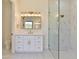 Elegant bathroom with a frameless glass shower, marble tile, and modern vanity at 2041 N Orchard --, Mesa, AZ 85213