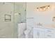 Bathroom with walk-in shower, toilet, and modern white vanity at 2041 N Orchard --, Mesa, AZ 85213